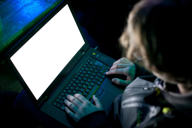 Man hacking a computer