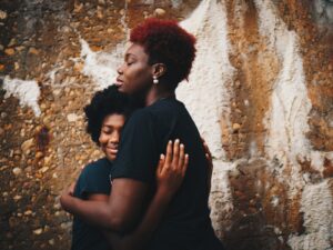 black mother and child hugging each other - BAME toolkit